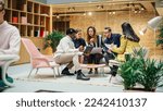 Small photo of Multiethnic Young Group of People Brainstorming Together in a Meeting Room at the Office. Black Male E-commerce Coordinator Pitching His Ideas To Startup Management Board Members Using Tablet