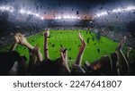 Small photo of Establishing Shot of Fans Cheer for Their Team on a Stadium During Soccer Championship. Team Scores Goal, Crowd of Fans Celebrate Victory Happily with Confetti. Football Cup Tournament Live.