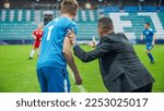 Small photo of Soccer Football Match Championship on Stadium, Coach Does Player Substitute. Professional Teams Play the Game. Major Cup, World Tournament. Real Game Strategy, Winning Tactics. Intense Competition.