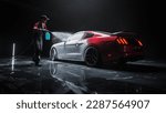 Small photo of Car Wash Detailer Spraying Smart Foam to Clean the Exterior of a Tuned Red Sports Coupe at a Performance Car Dealership. Advertising Style Footage of a Professional Hand Car Wash Service