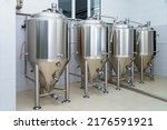 Stainless steel production vats in a brewery or food beverage industry. Background with copy space