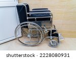 Folding wheelchair for people with special needs or disabilities with selective focus and blurry background, toned. Health and medicine.