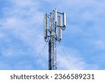 Telecommunication tower with blue sky background. Technology and communication concept.