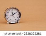 Small photo of Alarm clock Beautiful modern clock lies on paper background time clock time standstill time off work working with time