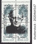 Small photo of RUSSIA - TOPKI, August 6, 2021: stamp printed by Russia, shows Cruiser Aurora, overprint portrait of Joseph Brodsky - Russian poet, circa 1996