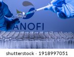 Small photo of Toronto, Ontario, Canada - February 14, 2021 : A health worker prepares to administer a shot of the French vaccine Sanofi. Name is blurry and vials containing Covid 19 vaccine.