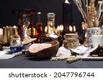 Small photo of Witchcraft table set, selective focus. Alchemy and esoteric symbol items for magic cult. Spiritual occultism and magic chemistry inspired by mysticism. Witch and warlock magician concept. Halloween.
