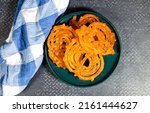 algeria sweet food named zlabi, in Inde named Jalebi, it is prepared with flour and yogurt and honey and other ingredients