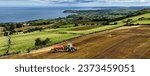 Small photo of Aerial Photo of Massey Ferguson 390T Tractor and Abbey Tanker spreading manure slurry in a field on a farm in UK 09-09-23