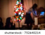 Christmas Home Party with Xmas Tree Light Decorated Looking for Music Playlist on Internet Isolated from Friend. Warm or Sad Melancholy for Introvert Person Not Mixed in Crowd. Winter Night Background