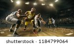 Small photo of Basketball players on big professional arena during the game. Tense moment of the game. Male caucasian and black players fight for the ball