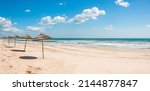 Small photo of Panoramic view of a deserted beautiful mediterranean beach in Tunisia.