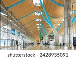 Small photo of MADRID, SPAIN - JUNE 13, 2023: Modern architecture inside the departure concourse at the Terminal 4 of Madrid Bajaras airport in Spain.