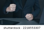 Small photo of Businessman pounding fist on table, cropped image. Angry businessman showing his fists. man with clenched fist on desk. boss clenching his fists in rage, failure in business