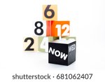 Small photo of On a white background,the block shows the number that represents the time elapsed. And the word "now" implies taking action now.
