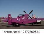 Small photo of Reno Stead, NV USA - Reno Air Races - September 15, 2023 - Plum Crazy airplane being taxied out on to the ramp