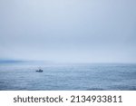 Small photo of A fishing boat in the fog just off the coast of Cape Flattery, Washington