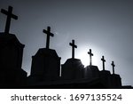 Small photo of Cemetery or graveyard in the night with dark sky. Headstone and cross tombstone cemetery. Rest in peace concept. Funeral concept. Sadness, lament, and death background. Spooky and scary burial ground.