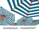 Small photo of Beach umbrellas isolated on white background. Blue and white striped beach parasol for summer vacation concept. Umbrella for tropical beach in summer. Sunshade for resort decoration. Holiday travel.