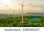 Small photo of Green hydrogen gas production at wind farm. Sustainable renewable energy. Electric car filling H2 at hydrogen fueling station. H2 Fuel cell vehicle. Net zero emission. Future energy. Green technology.