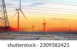 Small photo of Sustainable energy. Solar farm, wind turbine, and electric pylon with sunset sky. Sustainable resources. Solar, wind power. Renewable energy. Clean energy. Carbon neutrality and net zero emissions.