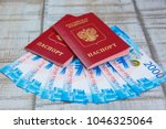 Small photo of Russian passport. The Russian Currency, including the new 2000 ruble-denominated promissory notes the Concept of travel and business