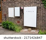 Small photo of York, UK - June 25 2022: Tesla Powerwall 2 and Backup Gateway 2 installed on a brick house wall