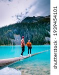 Small photo of Majestic mountain lake in Canada. Upper Joffre Lake Trail View, couple visit Joffre Lakes Provincial Park - Middle Lake. British Columbia Canada, couple men and woman hiking by the lake