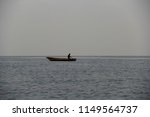 Fisherman In A Isolated Boat In ...