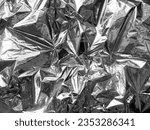Small photo of Metal foil texture for background. deflated balloon