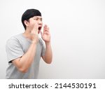 Asian man gesture shout serious face looking at copy space