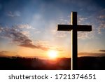 Cross at sunset, crucifixion of Jesus Christ