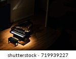 Black grand piano at spot light ...
