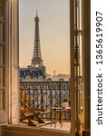Small photo of paris balcony with splendid view on eiffel tower at sunset