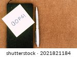 Small photo of OOPS! Written on sticky notes. Mistake Learning, wrong, blooper, error regret sayings background. Fault, defect, careless lesson correction and reconciliation thought concept. Table top view. Flat Lay