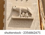 Small photo of Relief of a she-wolf suckling ancient Capitoline children on the wall of the house in Rome. 22 June 2023 Italy