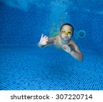 Young Boy Fun In The Swimming...