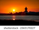 Small photo of Beautiful orange sunset panorama at the harbor of Isla Cristina, Costa de la Luz, Spain, with the lighthouse as a silhouette