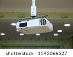 High quality Projector(4K) at the ceiling in conference room with copy space.Projector at business conference or lecture.For offices and training facilities. Irradiation.