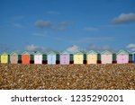 A Row Of Ten Colorful Beach...
