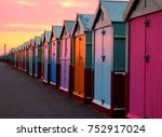 A Line Of 30 Beach Huts With A...