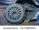 Small photo of Clutch Cover expire on background gear transmission.Old Metallic clutch on Truck clutch system