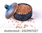 Small photo of Raw Buckwheat Pile, Dry Buck Wheat Grains, Uncooked Buckwheat, Bowl with raw uncooked buckwheat