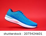 Blue Running Sneaker On Red...