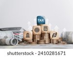 Small photo of Tax concept with icons on wooden blocks Tax reduction planning, expenses, accounting, VAT and property taxes. Request a tax refund and submit taxes for online tax documents to the government.
