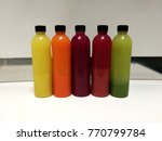 cold pressed juice bar in bottle | Shutterstock . vector #770799784