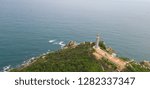 Small photo of Aerial view of Dai Lanh beach and Mui Dien light house in sunny day, MuiDien, Phu Yen province - The eastermost of Vietnam. Stock photo image top view of Mui Dien lighthouse on fractured rocky cliff