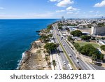 Small photo of Aerial view of the Santo Domingo, Capital Of Dominican Republic, its beautiful streets and buildings, la Fuente Centro de los Heroes, the Pabellon de las Naciones