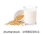 Glass of Soy milk with soybeans in white bowl isolated on white background.