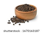 Black peppercorns (Black pepper) in wooden bowl isolated on white background.